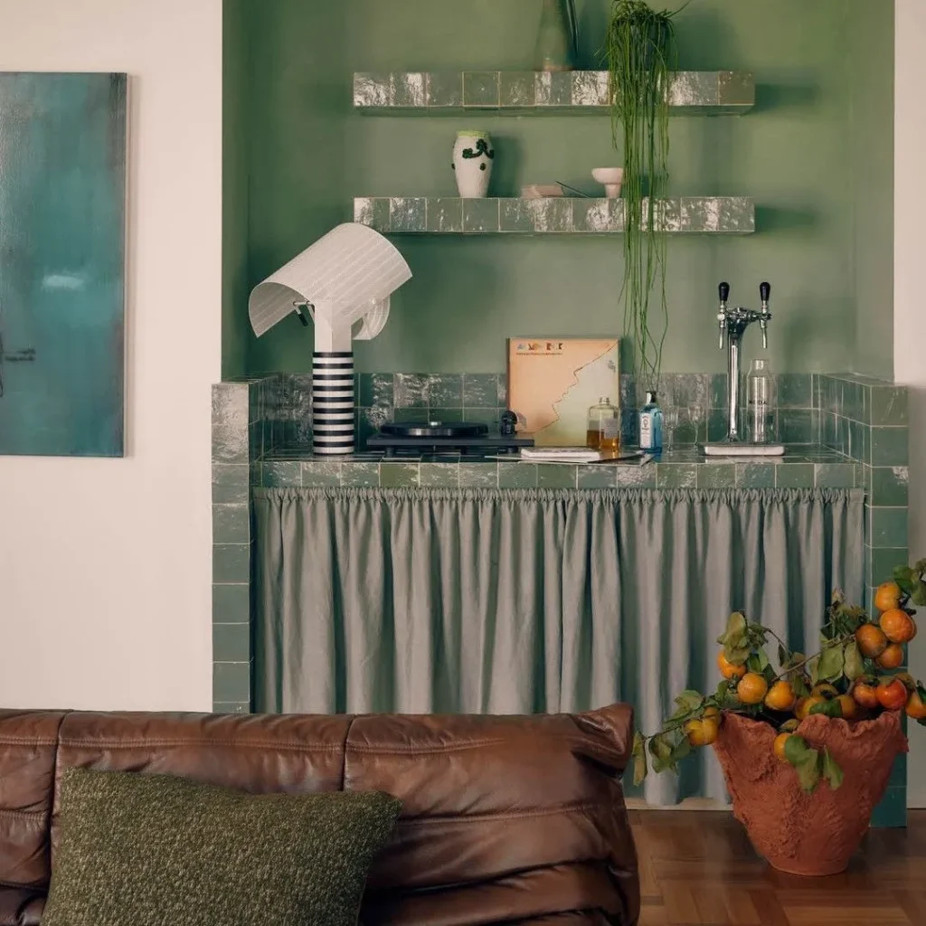 Mario Botta Shogun table lamp for Artemide on a green tiled kitchenette shelf